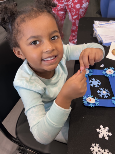 Kid decorating a foam picture frame