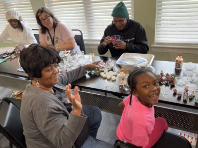 Pat and Will decorating snow globes