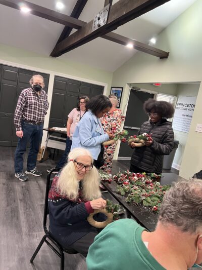 Carol and Ethan making wreaths