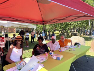 Four board members at a craft table