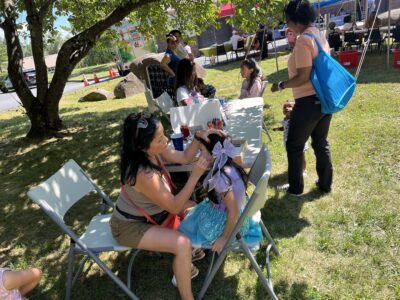 Woman setting up supplies for facepainting
