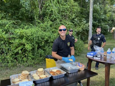 Incoming police chief preparing food