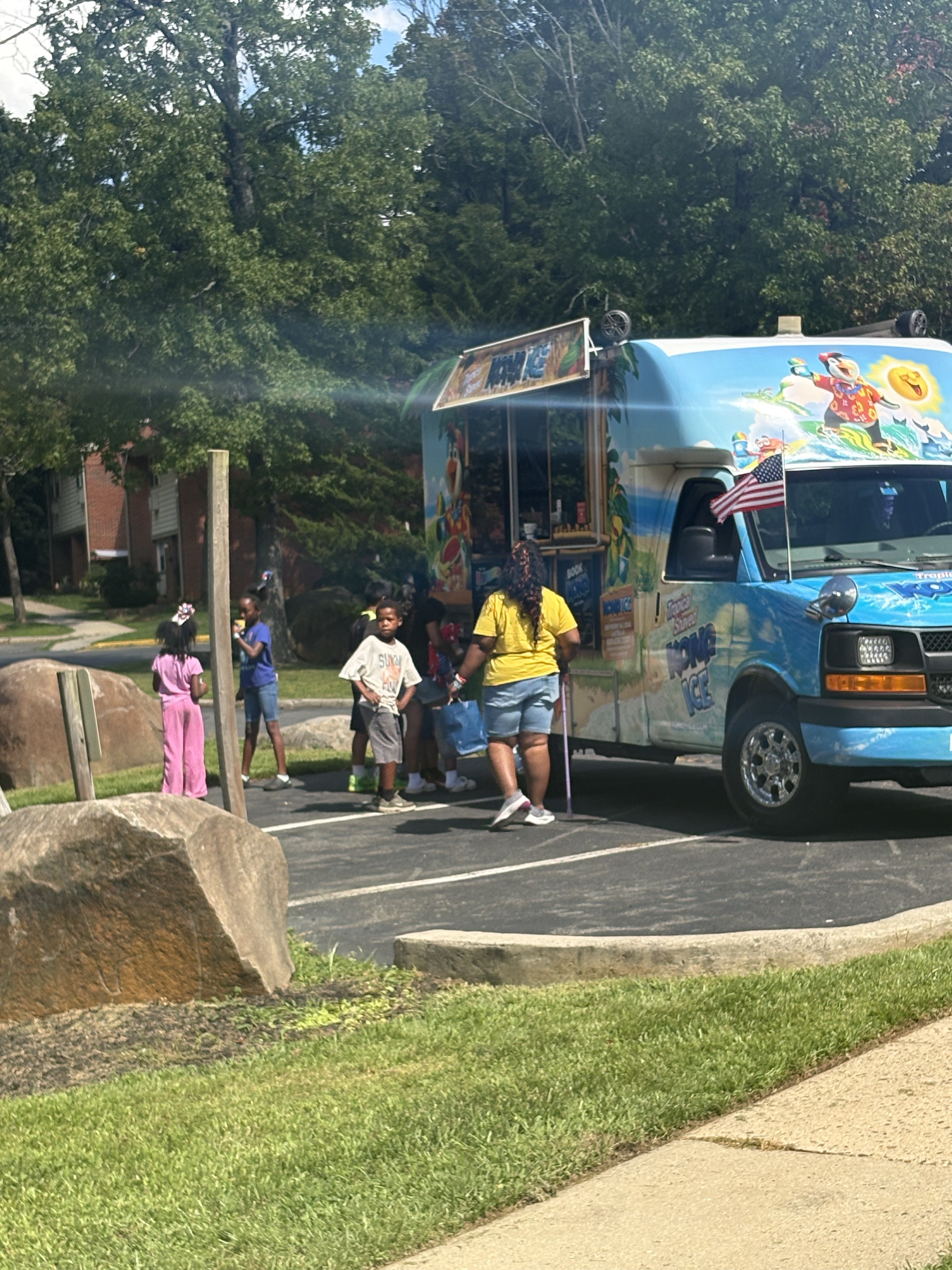 Image of children getting snow cones