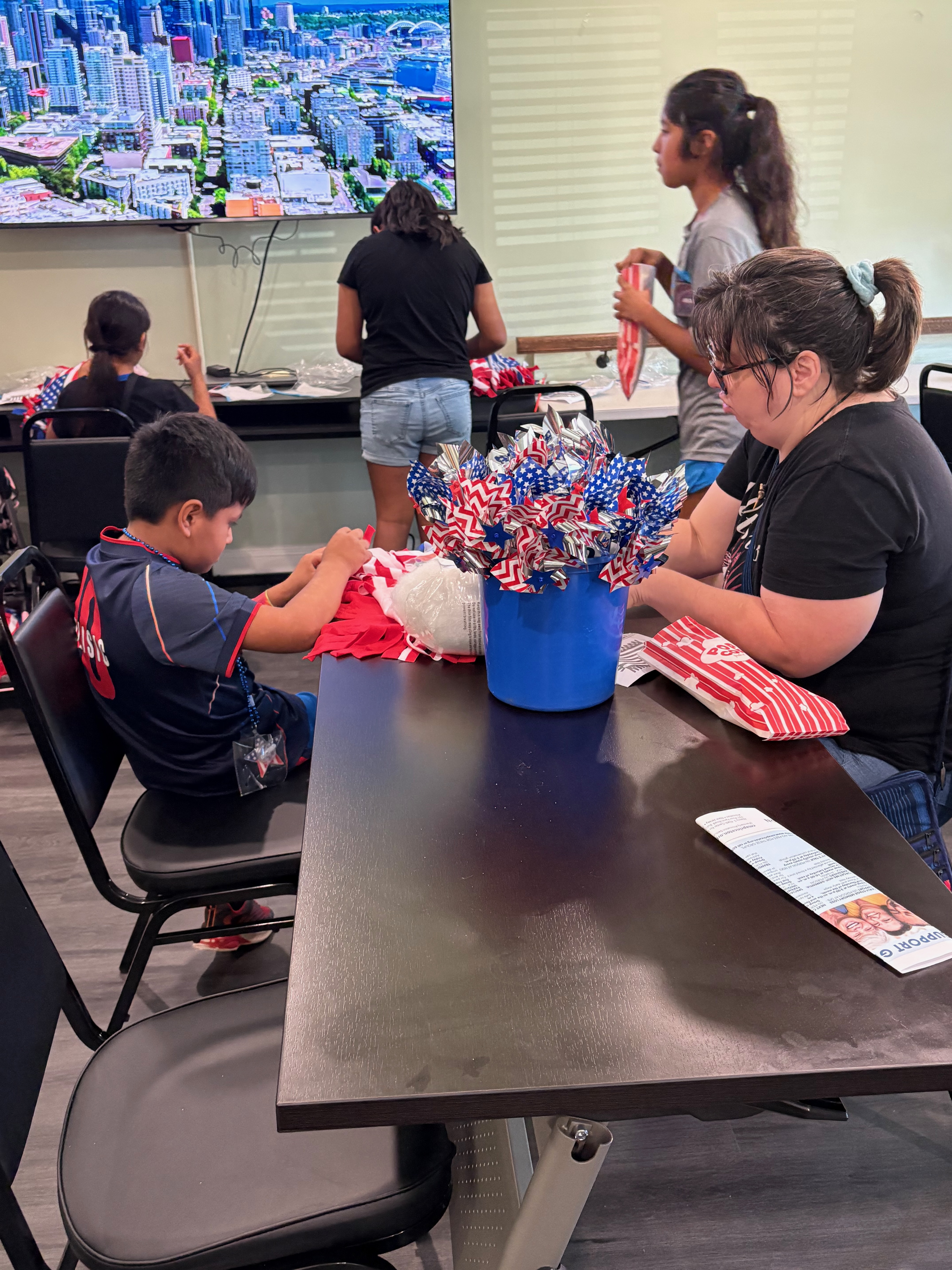 Tenants working on a flag