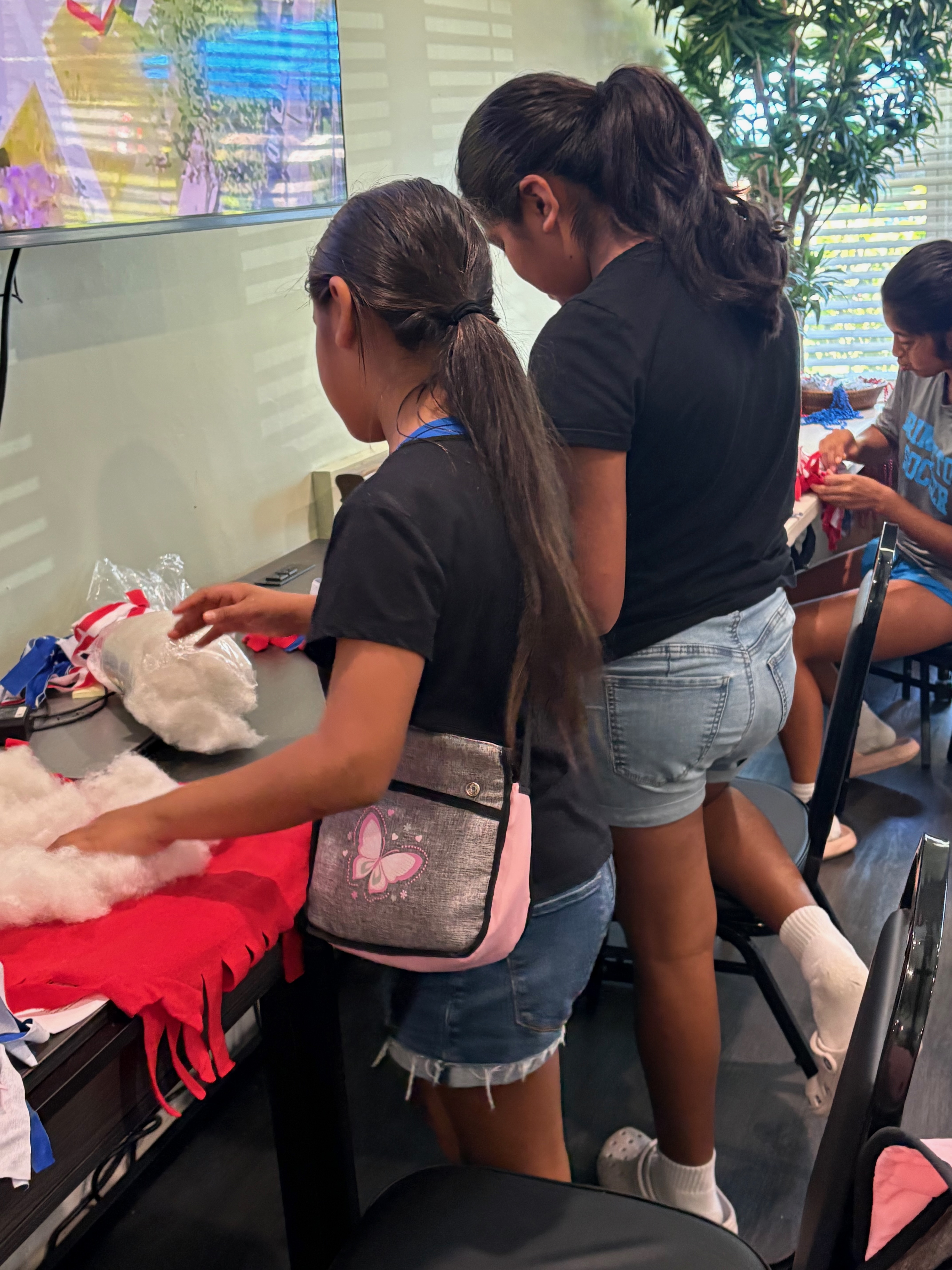 Children getting supplies to make a flag